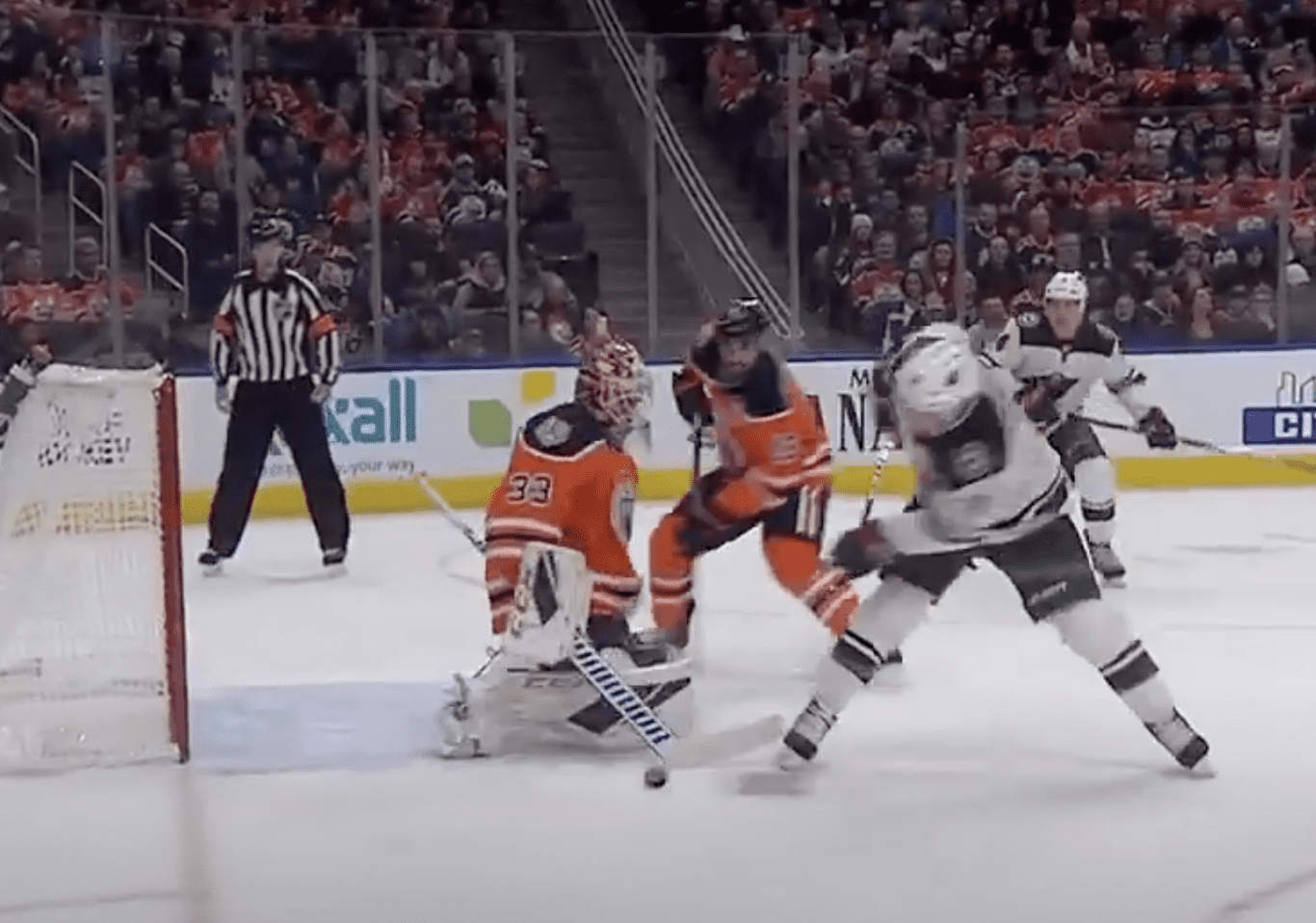 Image shows Zach Parise shooting off balance for goal